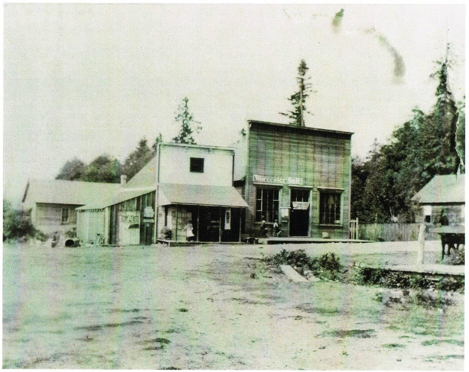 Old photo of wooden store fronts