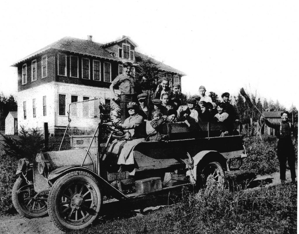 Several men in old style truck