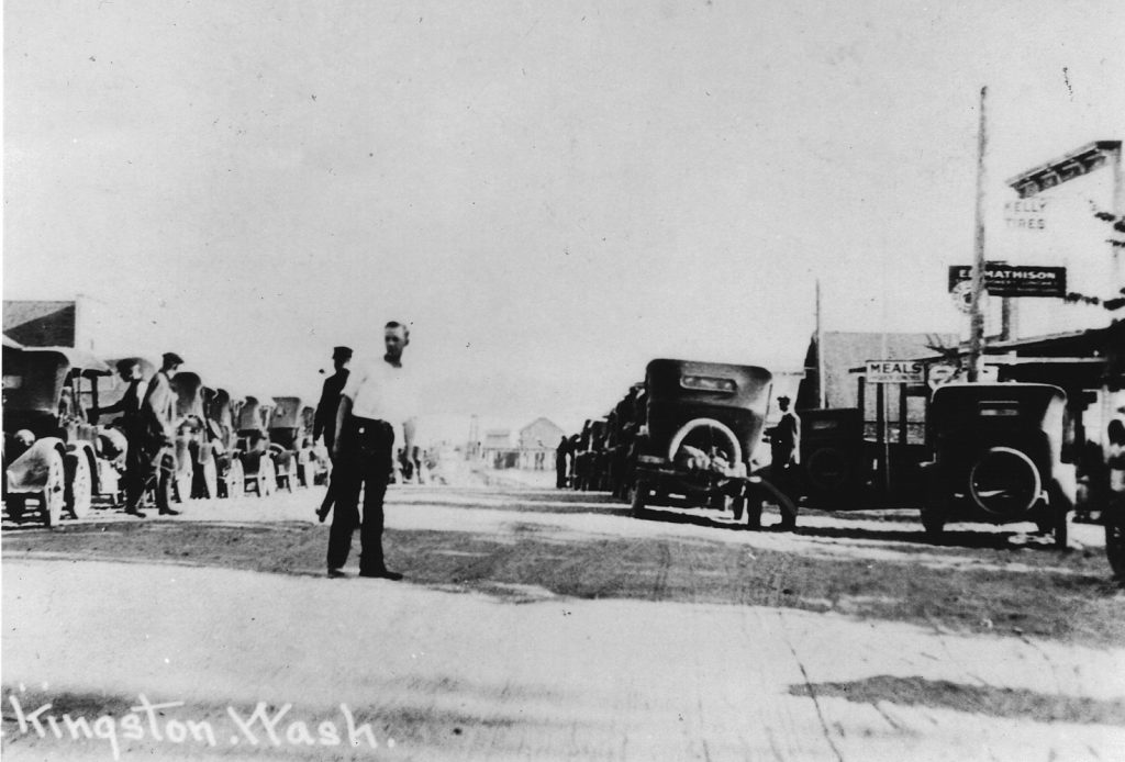 Old photo of man directing ferry traffic